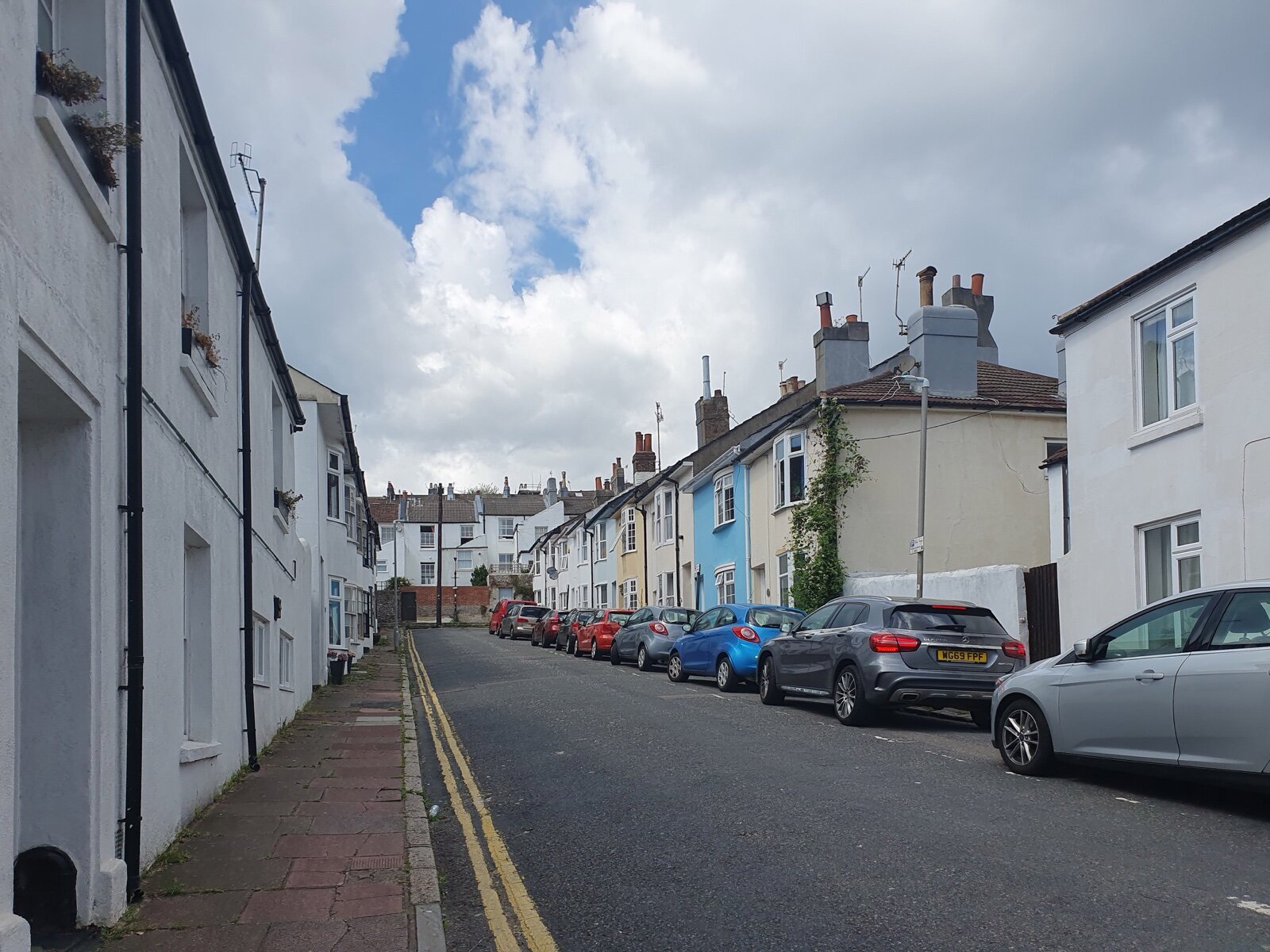 Terrace of painted Victorian houses on Railway Street, Brighton, East Sussex
