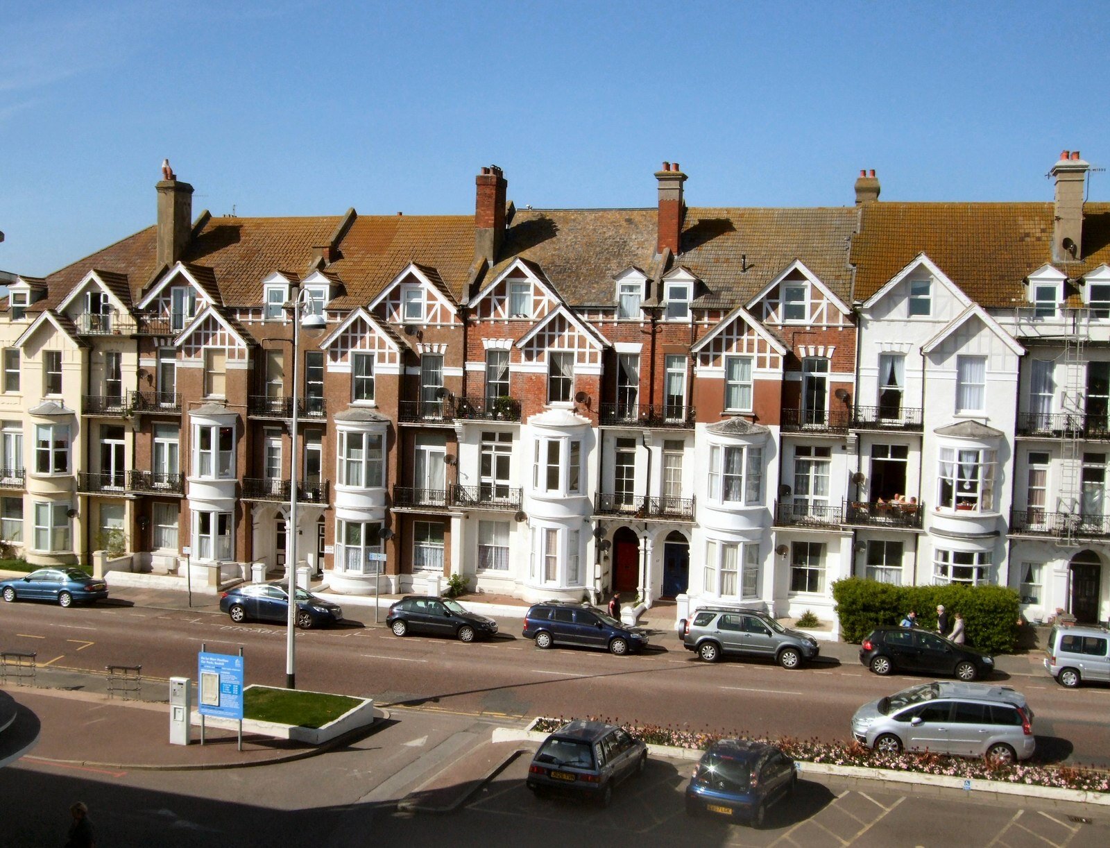 Victorian and Edwardian seafront terraces at Bexhill-on-Sea, with on-street parking in front