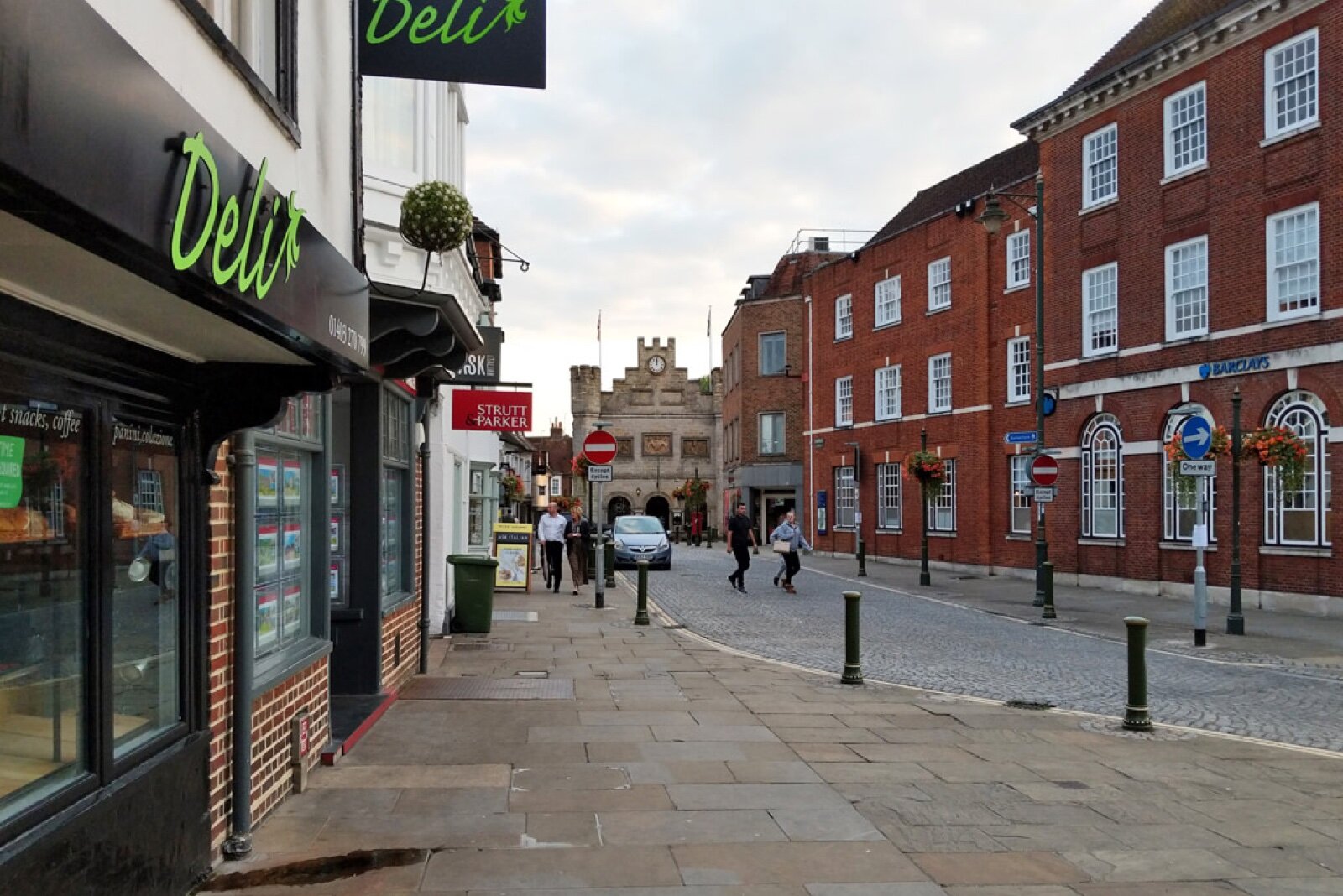 Horsham town centre looking towards the Old Town Hall, with narrow pavements and on-street bays