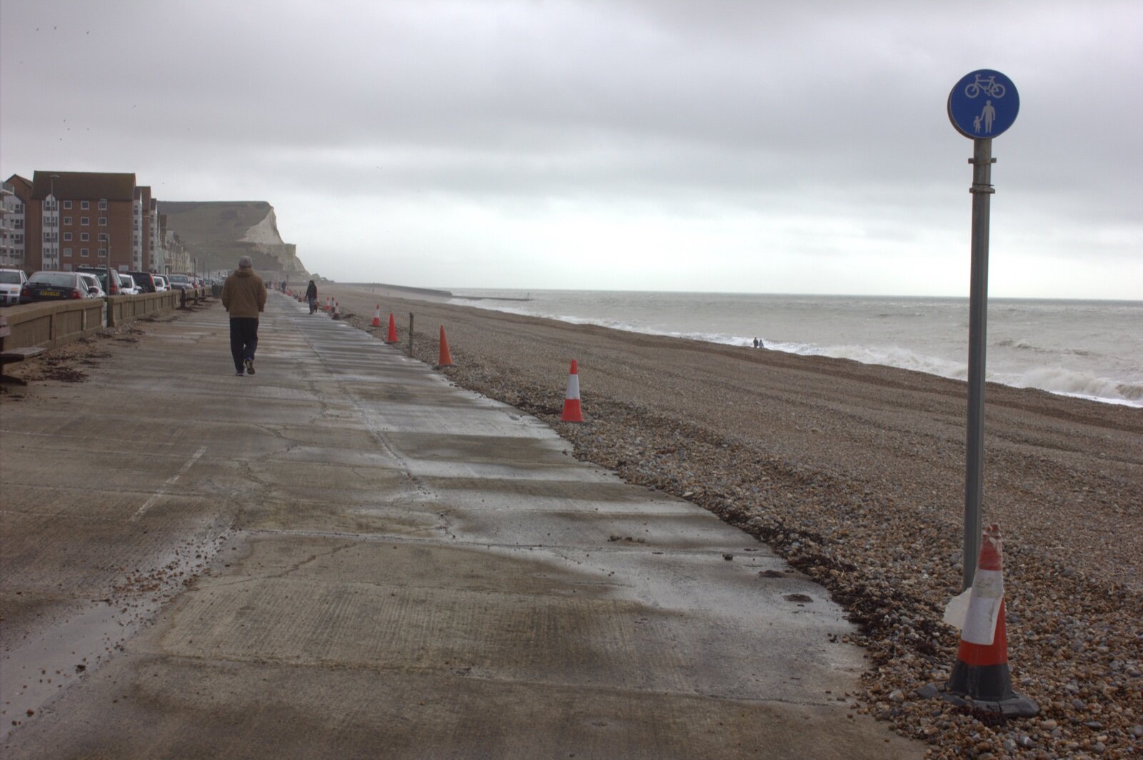 Seaford seafront promenade looking east towards Seaford Head, with blocks of flats on the left