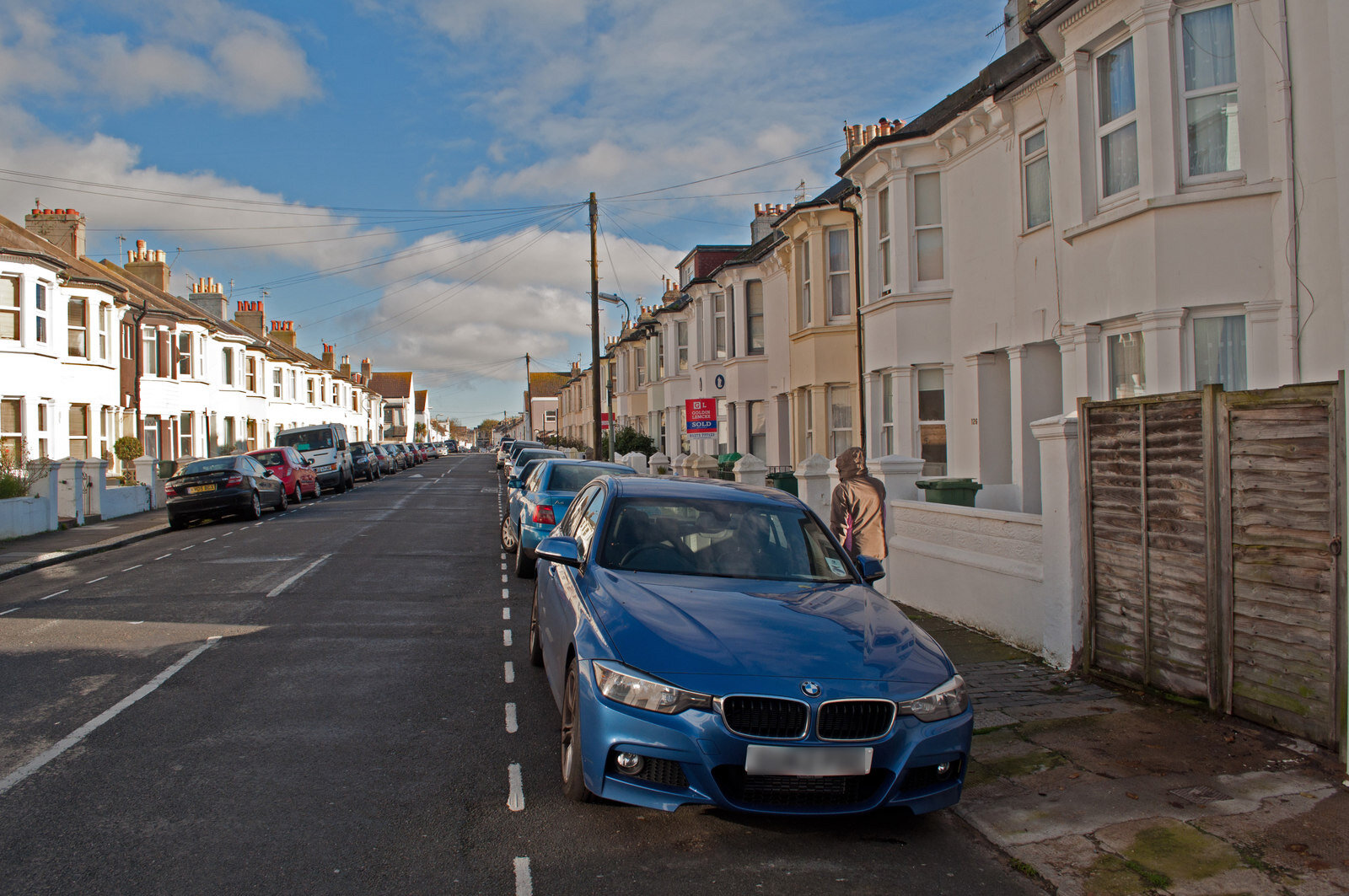 A terraced residential street of bay-fronted houses in Hove