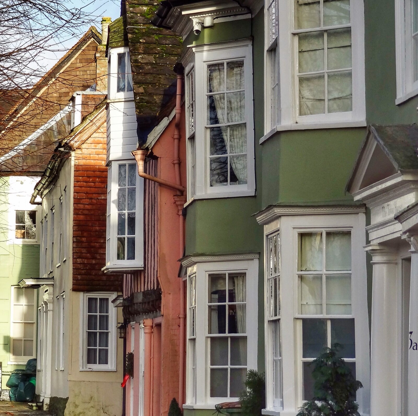 A row of painted period houses on the Causeway in Horsham, West Sussex
