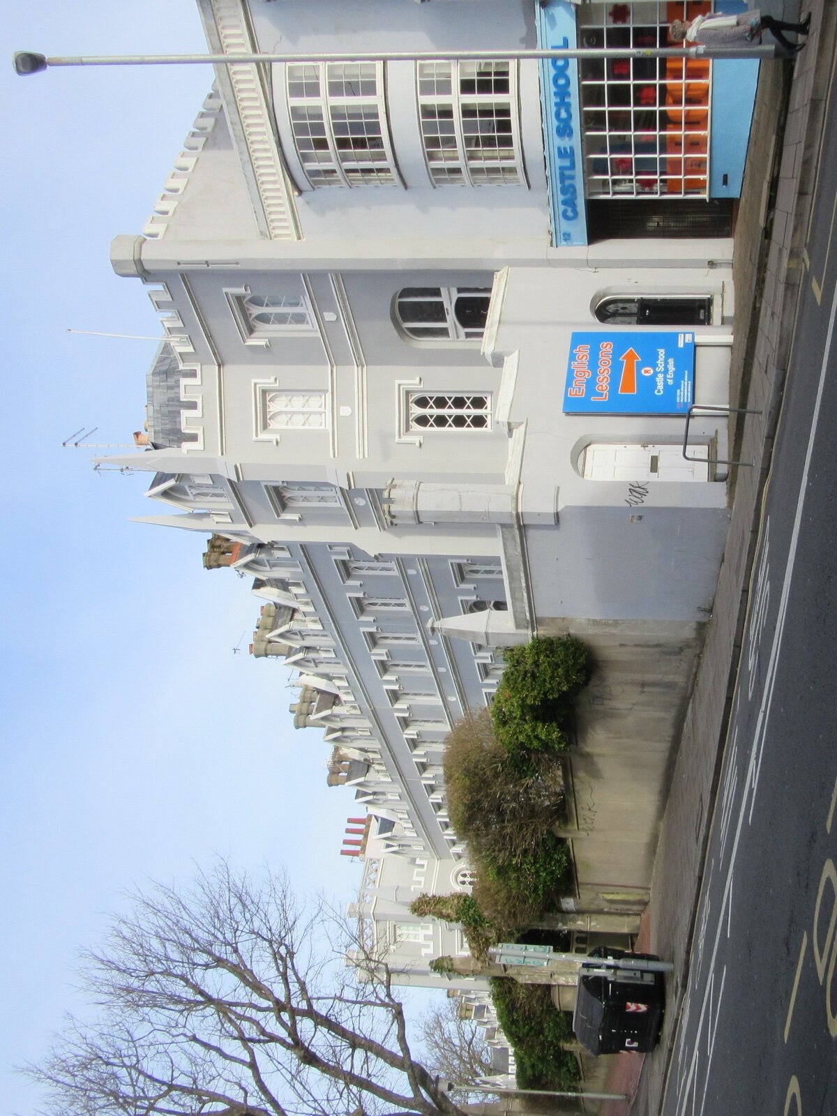 A residential terrace of houses on a street in Brighton